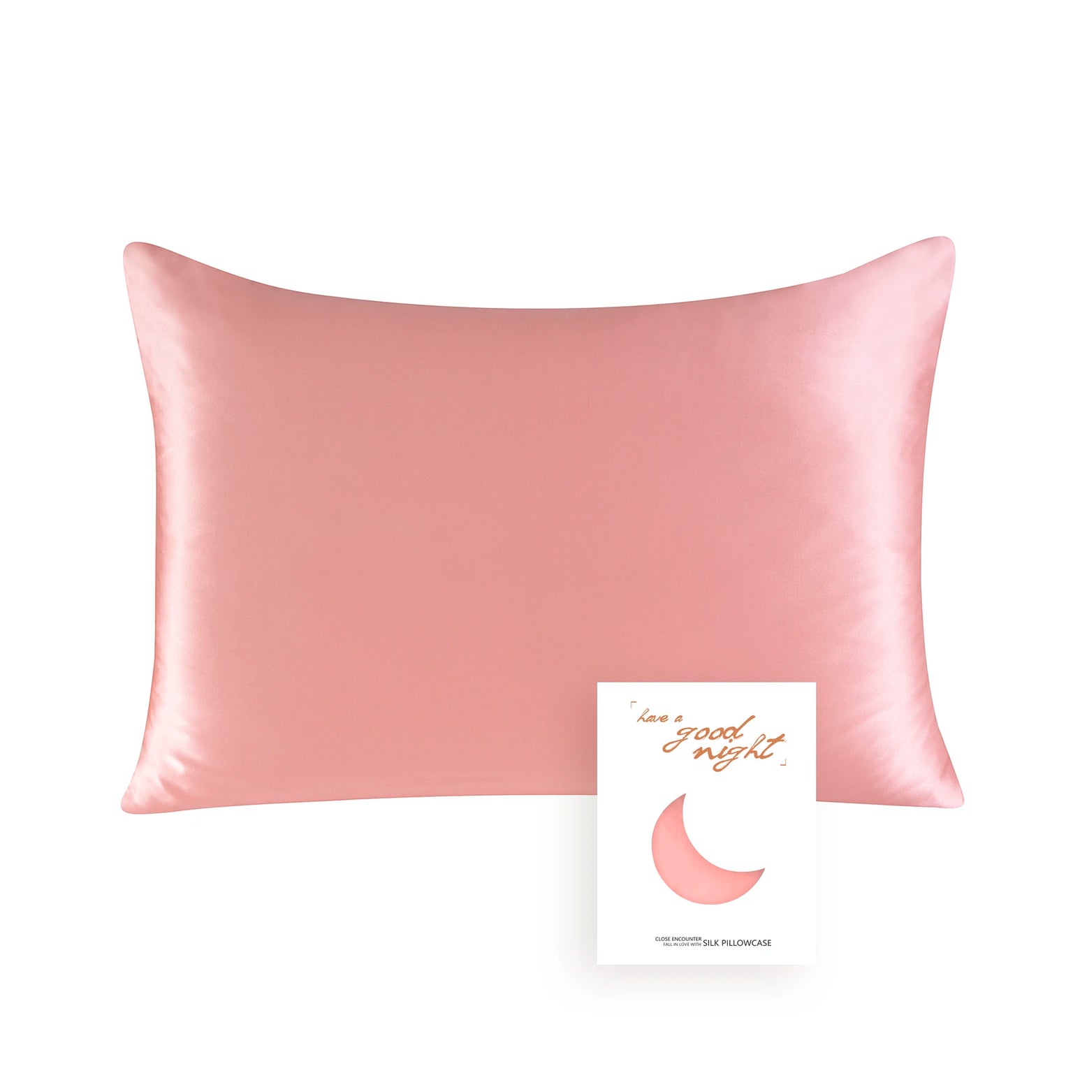 Pink satin pillowcase with a card on a white background