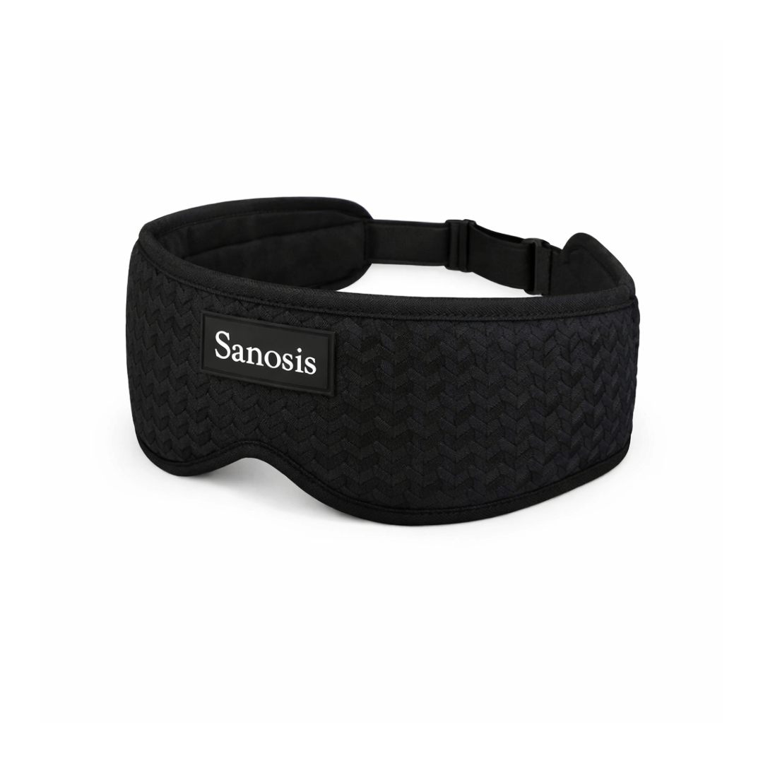 A black textured sleep mask with an adjustable strap and a black brand label reading 'Sanosis' on the front, set against a plain white background.