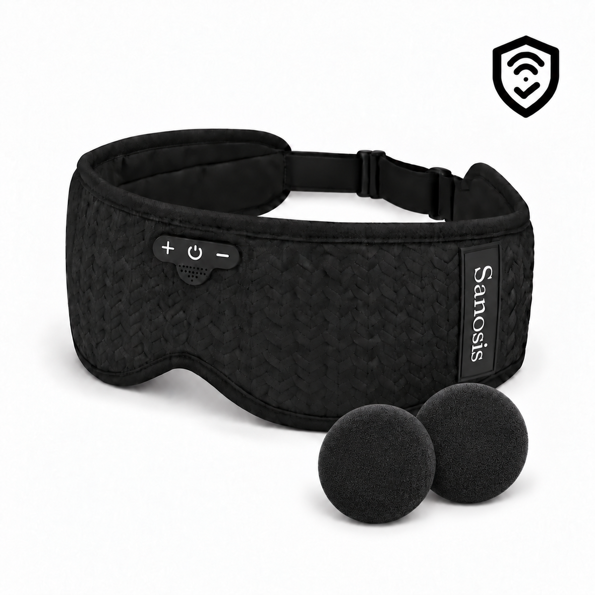 Black Sanosis wireless eye mask with a textured fabric cover, built-in control buttons, adjustable strap, and two black foam ear cushions, shown on a white background with a black shield icon in the top right corner.