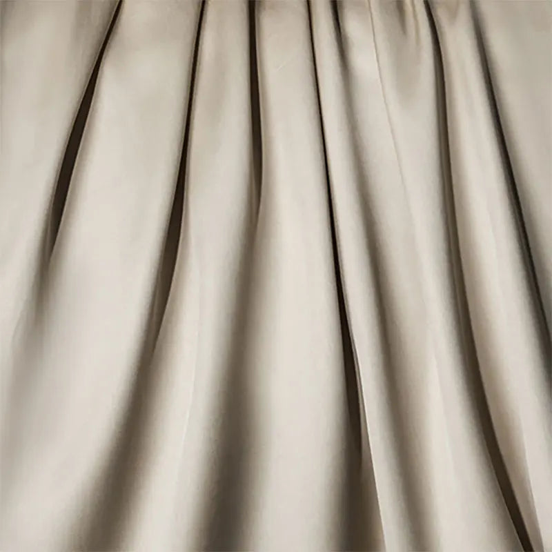 Close-up of beige fabric with folds